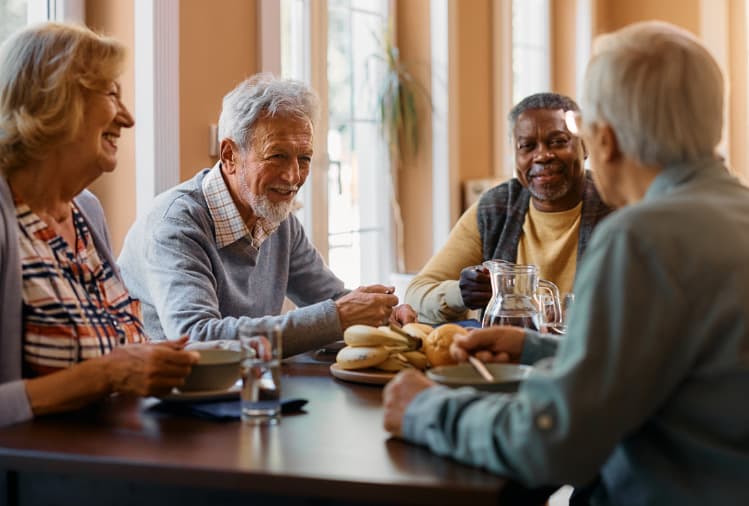 Seniors enjoying breakfast at the table